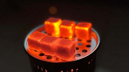 The final result of environmentally friendly charcoal briquettes is ready to use.